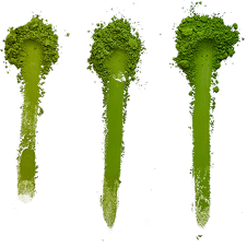 Three streaks of matcha powder on a white background
